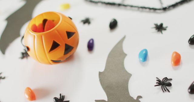 Close up of multiple halloween toys and candies on white background. halloween festivity and celebration concept