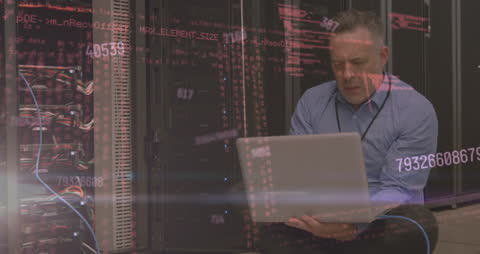 Technician Analyzing Data Servers with Digital Overlay