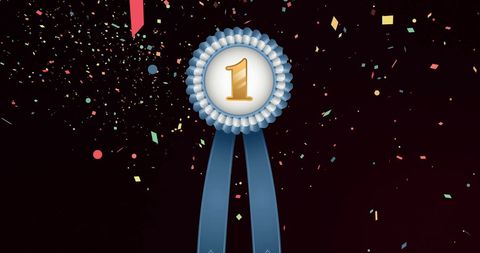 Gold number one medal with blue ribbon amidst confetti celebration