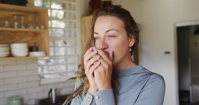 Relaxed Woman Drinking Hot Beverage in Modern Kitchen - Download Free Stock Images Pikwizard.com