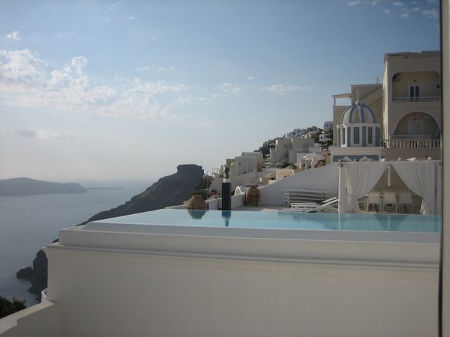 Infinity Pool with Ocean View in Santorini's Whitewashed Architecture - Download Free Stock Photos Pikwizard.com