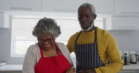 Elderly Couple Joyfully Cooking at Home with Love - Download Free Stock Images Pikwizard.com