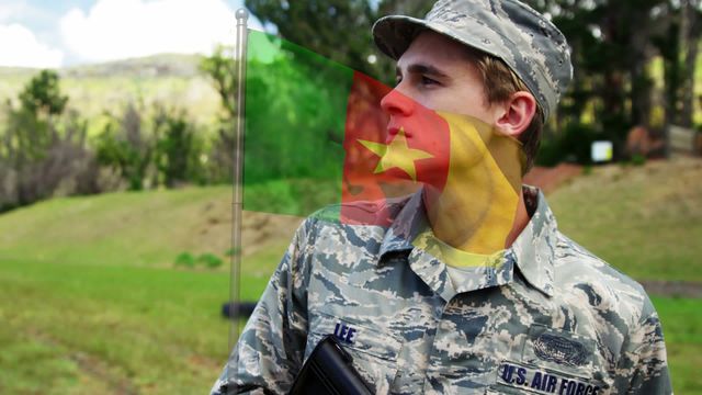 A soldier is gazing thoughtfully, coupled with the flag of Cameroon. The combination of military image and national flag highlights a theme of patriotism and service. Useful for projects related to international solidarity, military celebrations, or cultural integration themes.