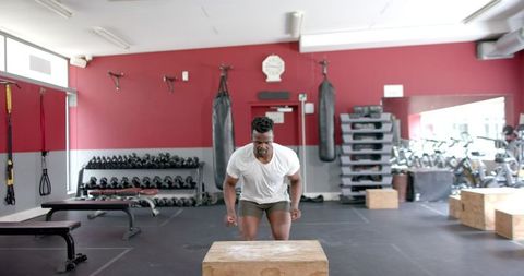 focus on agility: man performing step-ups at gym - Download Free Stock Images Pikwizard.com
