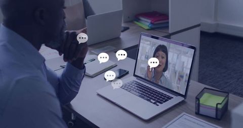 Business professional in online video conference from office desk