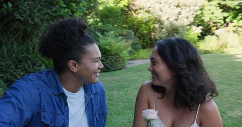 Happy Couple Relaxing Outdoors with Fresh Fruit Picnic