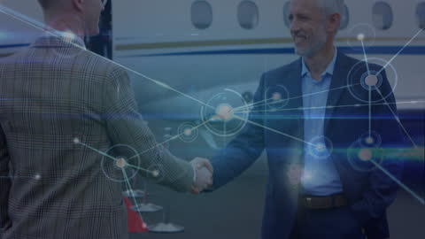 Diverse Business Executives Shaking Hands at Airport with Networking Overlay
