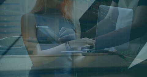 Innovative Colleagues Collaborating on Digital Project in Office