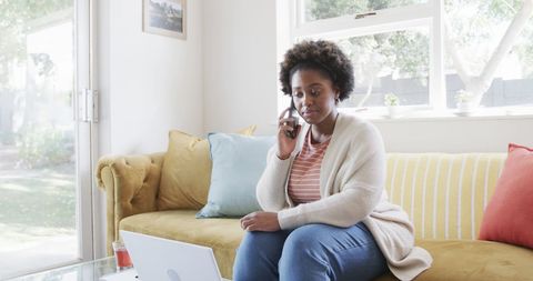Woman Using Smartphone and Laptop in Cozy Home Setting - Download Free Stock Images Pikwizard.com