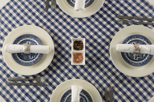 Overhead of rolled up napkin arranged on plate