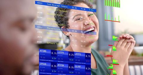 Smiling professional woman analyzing market data with holographic tickers and charts