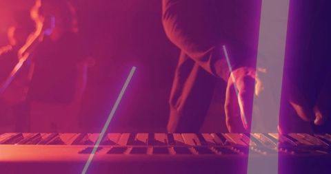 Keyboard Player Performing Under Magenta Neon Lights on Foggy Club Stage