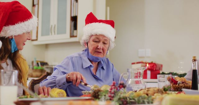 Family Celebrating Christmas Dinner with Festive Hats - Download Free Stock Images Pikwizard.com