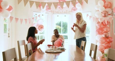 Friends decorating space for a celebration party