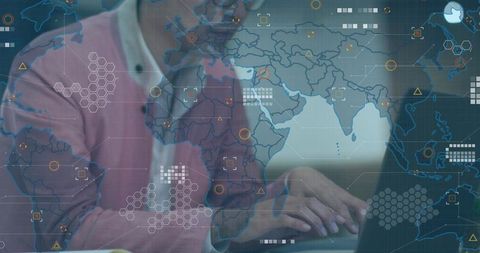 Mature asian man typing on laptop with ar world map overlay for geospatial data analysis