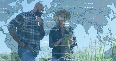 Farmers checking tablet in corn field with augmented reality world map and data overlay