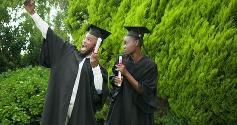 Joyful Graduates Celebrating Success with Diplomas