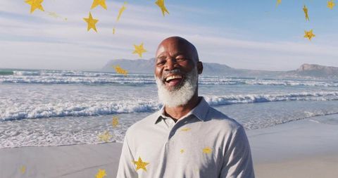 Joyful Senior Man at Beach with Golden Star Overlays