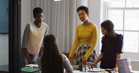 Businesswomen Collaborating in Office Meeting