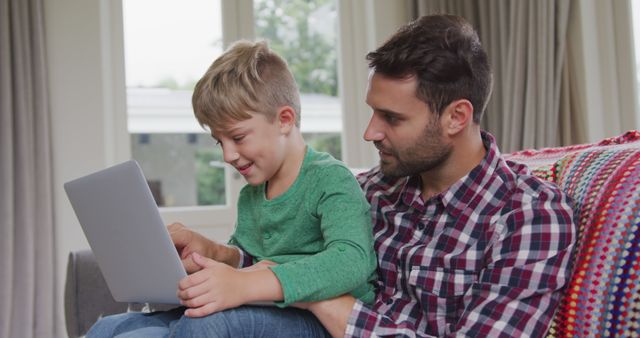 Father and Son Bonding While Using Laptop at Home - Download Free Stock Images Pikwizard.com