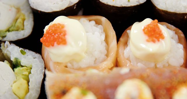 Close-up of Various Sushi Rolls with Roe and Mayonnaise - Download Free Stock Images Pikwizard.com