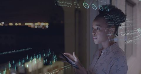 Businesswoman Analyzing Financial Data at Night - Download Free Stock Images Pikwizard.com