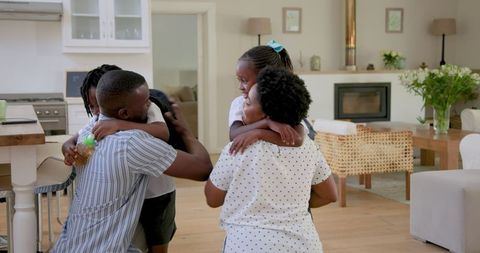 Family Energizing Children for School Morning in Cozy Home Setting