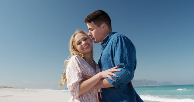 Romantic Couple Laughing and Embracing on Beach - Download Free Stock Images Pikwizard.com