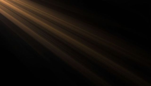 Ethereal Golden Light Rays with Floating Dust Particles