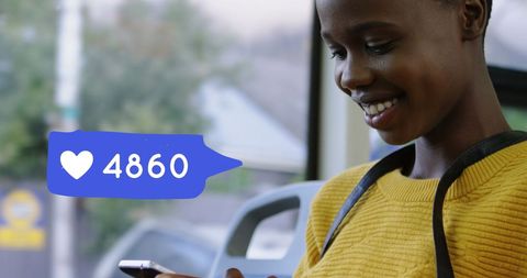 Smiling Woman Checking Phone Likes on Bus Journey