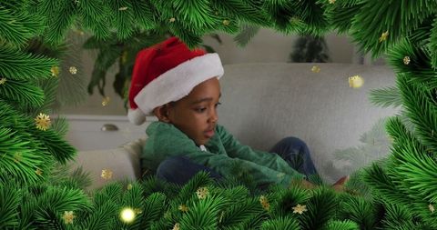 Boy in Santa Hat Enjoying Cozy Holiday Home Surroundings