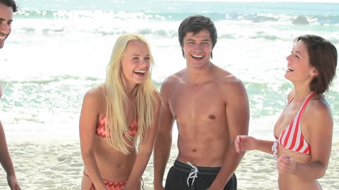 Friends Enjoying Fun Beach Day in Swimwear