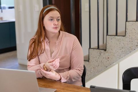 Woman Freelancer Using Laptop at Home Office Collaborating