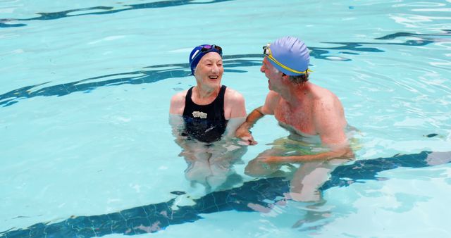 Senior Couple Enjoying Time Together in Pool - Download Free Stock Images Pikwizard.com