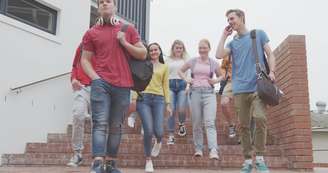 Group of Students Walking Downstairs Outdoors Together - Download Free Stock Images Pikwizard.com