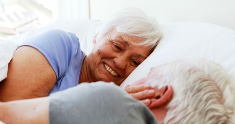 Loving Senior Couple Embracing in Cozy Bedroom - Download Free Stock Images Pikwizard.com