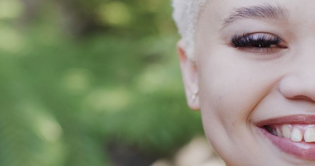 Close-Up of Young Woman Smiling with Closed Eyes and Flawless Skin - Download Free Stock Images Pikwizard.com