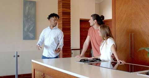 Friends Touring Modern Kitchen in Contemporary Home