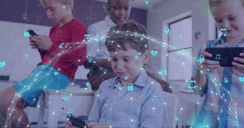 Young Students Exploring Digital World on Smartphones in Classroom