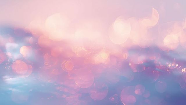 Dreamy pastel bokeh with glowing orbs and soft lens flare, sparkling abstract background