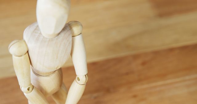 Wooden Art Mannequin Posing on Wooden Background - Download Free Stock Images Pikwizard.com