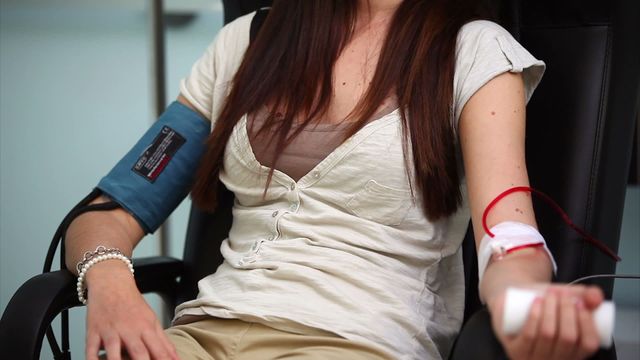 Video showcases a woman donating blood in a hospital setting. Ideal for medical, healthcare, and wellness campaigns, or articles and content focused on blood donation, medical procedures, and hospital care amenities. Can be used for educational purposes or awareness campaigns related to blood donation.