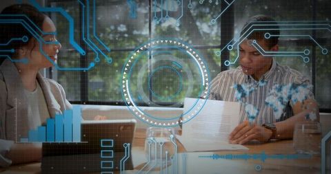 Business team reviewing documents with augmented reality hud showing data analytics