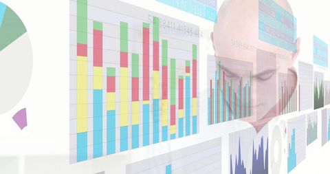 Business analyst reviewing interactive data dashboards with colorful stacked bar charts