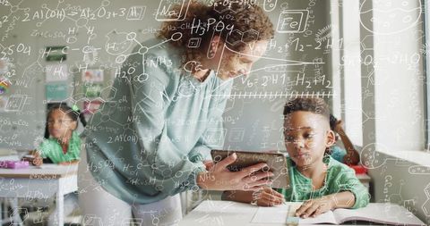 Female Teacher Assisting Child in Classroom with Chemical Equations Overlay