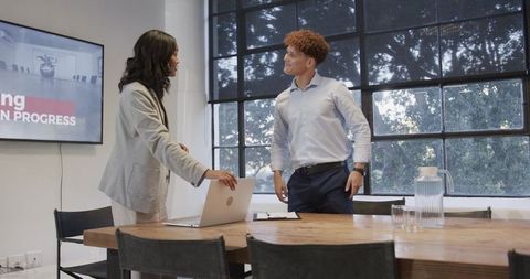 Professionals shaking hands for successful business partnership