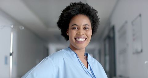 Smiling Nurse in Hospital Corridor Representing Healthcare Dedication