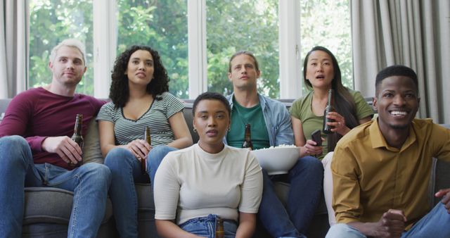 Group of Diverse Friends Watching Television on a Couch - Download Free Stock Images Pikwizard.com