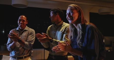 Business team celebrating success with applause