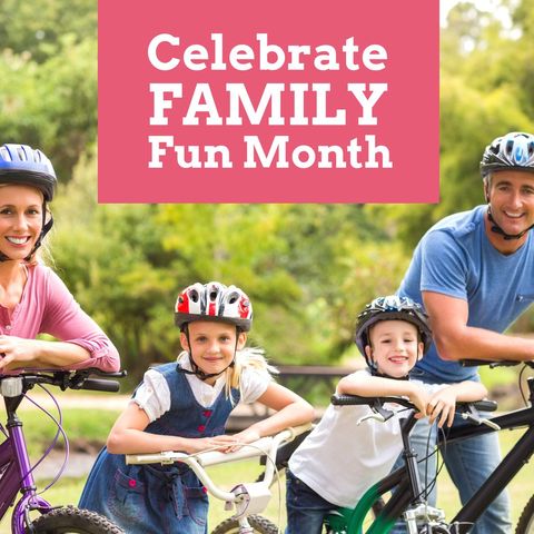 Family month celebration with smiling parents and kids on bikes